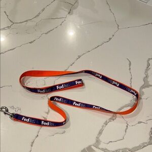 FedEx Branded Orange and Purple 5 ft. dog leash.